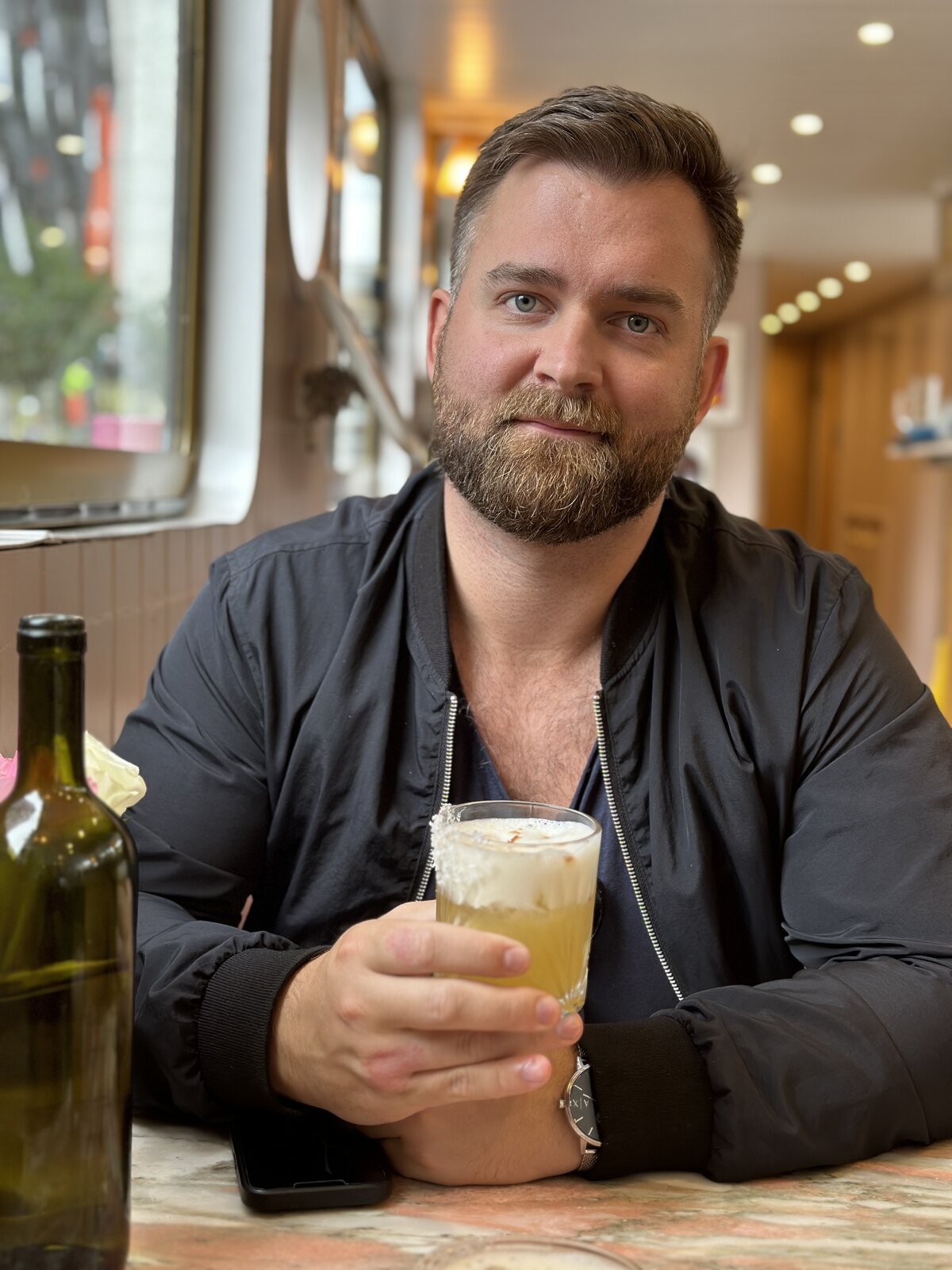Martin, bomber jacket, tropical drink