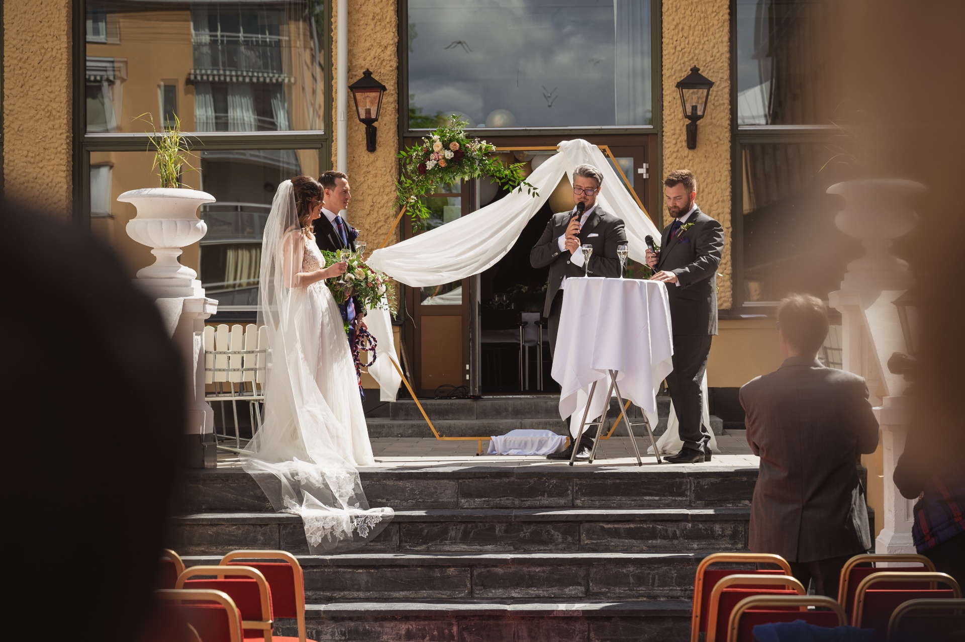 My wedding ceremony — Martin singing while I stand there beaming