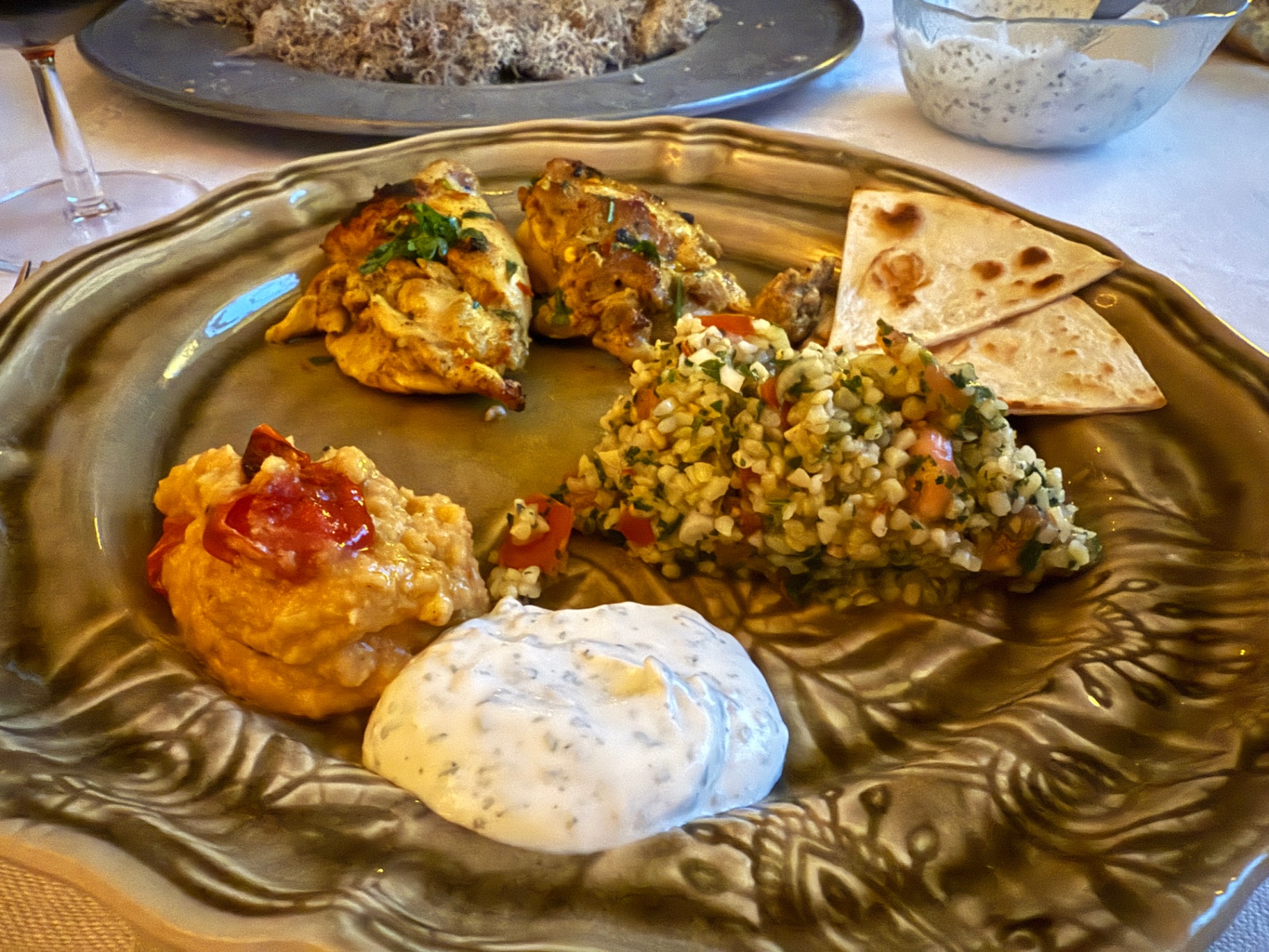 Mezze plate — chicken, tabbouleh, flatbread, tzatziki